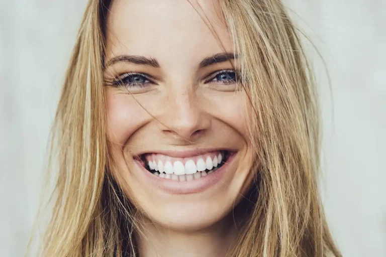 Dental Patient Smiling After Full-mouth rehabilitation at Cinco Ranch Dental in Katy, Texas